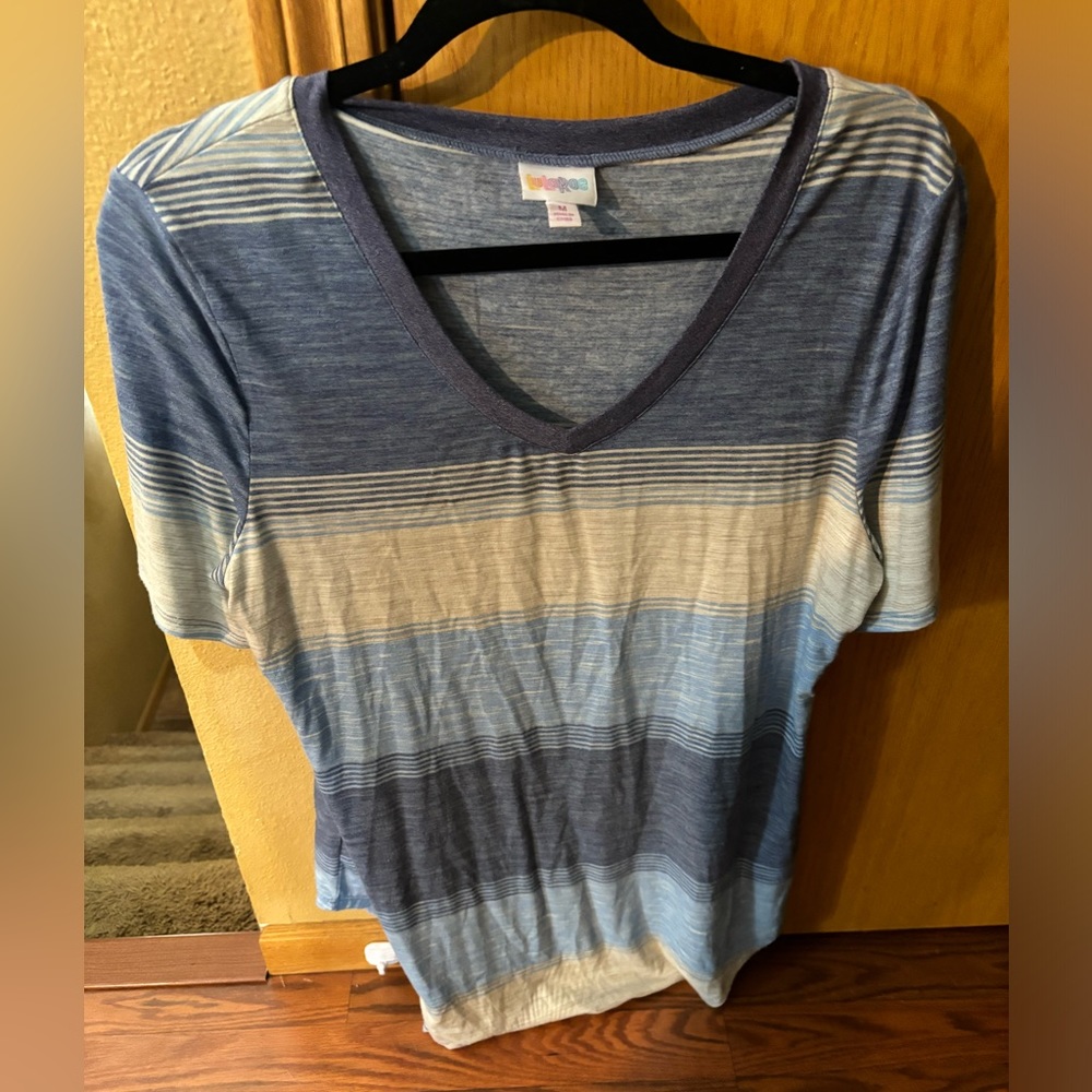 Size Medium like new short sleeve tshirt. Only worn a few times. LuLaRoe